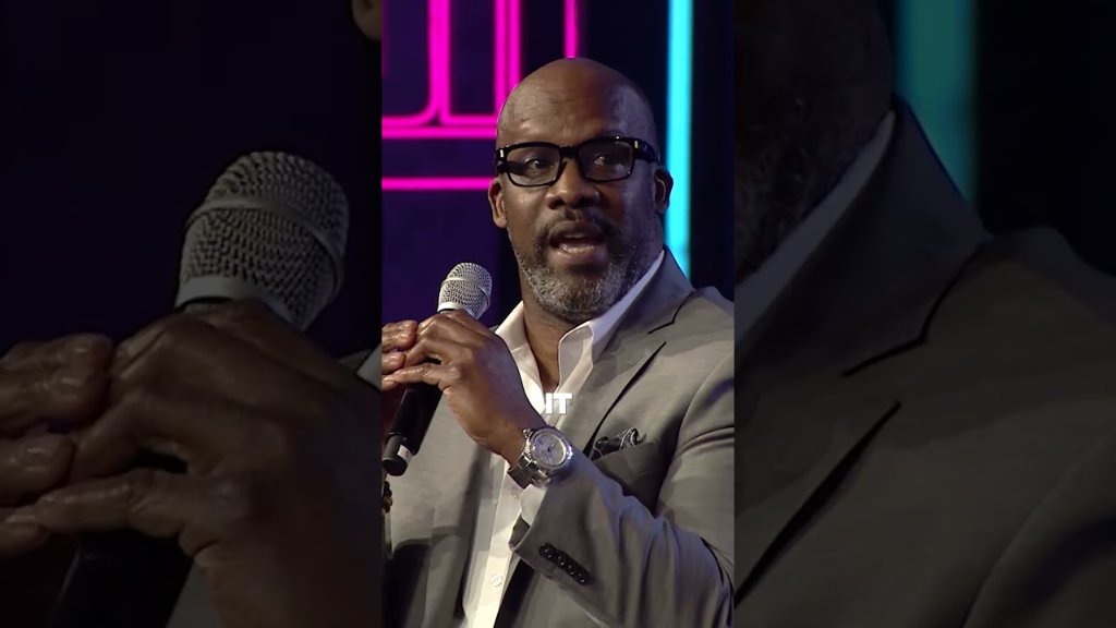C.W. Zev speaking with microphone