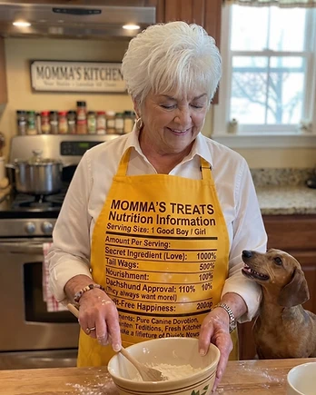 Momma Gail in her kitchen with her dachshund