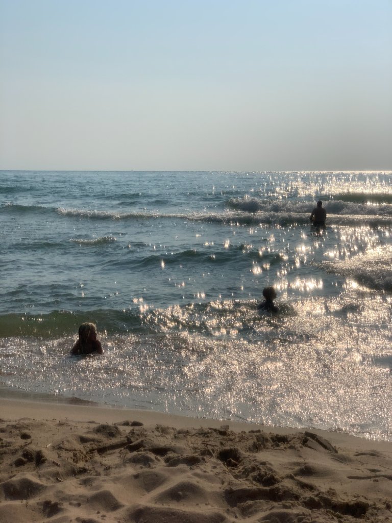 Family swimming in Lake Superior after the sauna
