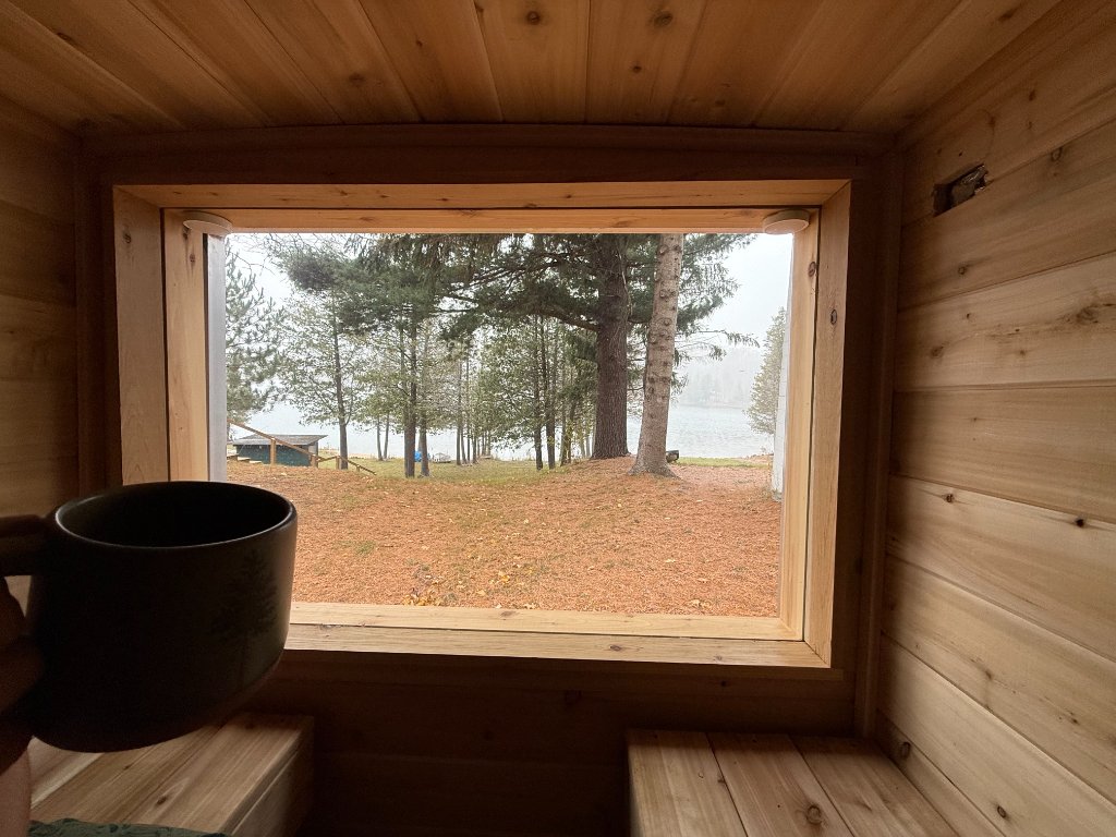 Sauna window view with coffee
