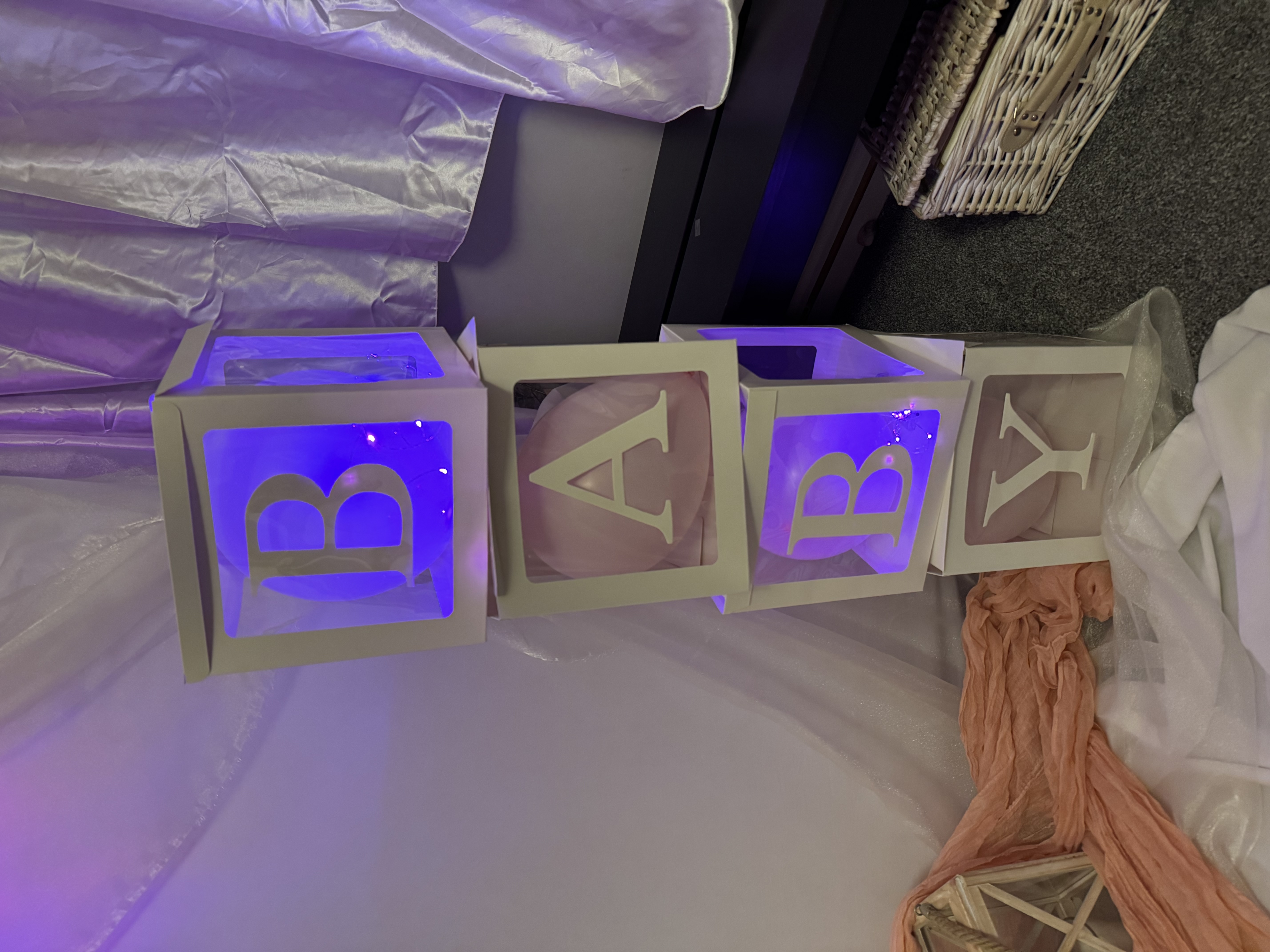 Illuminated BABY letter blocks with blue and purple LED lighting for a baby boy celebration