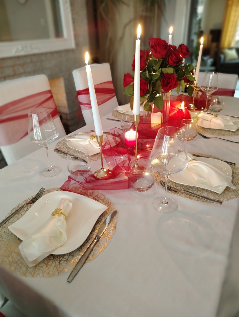 Romantic red rose candlelit table centrepiece for a wedding reception