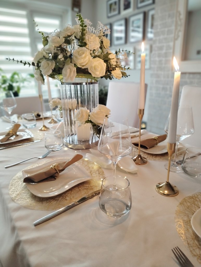 White and rose gold wedding table setting with elegant place settings