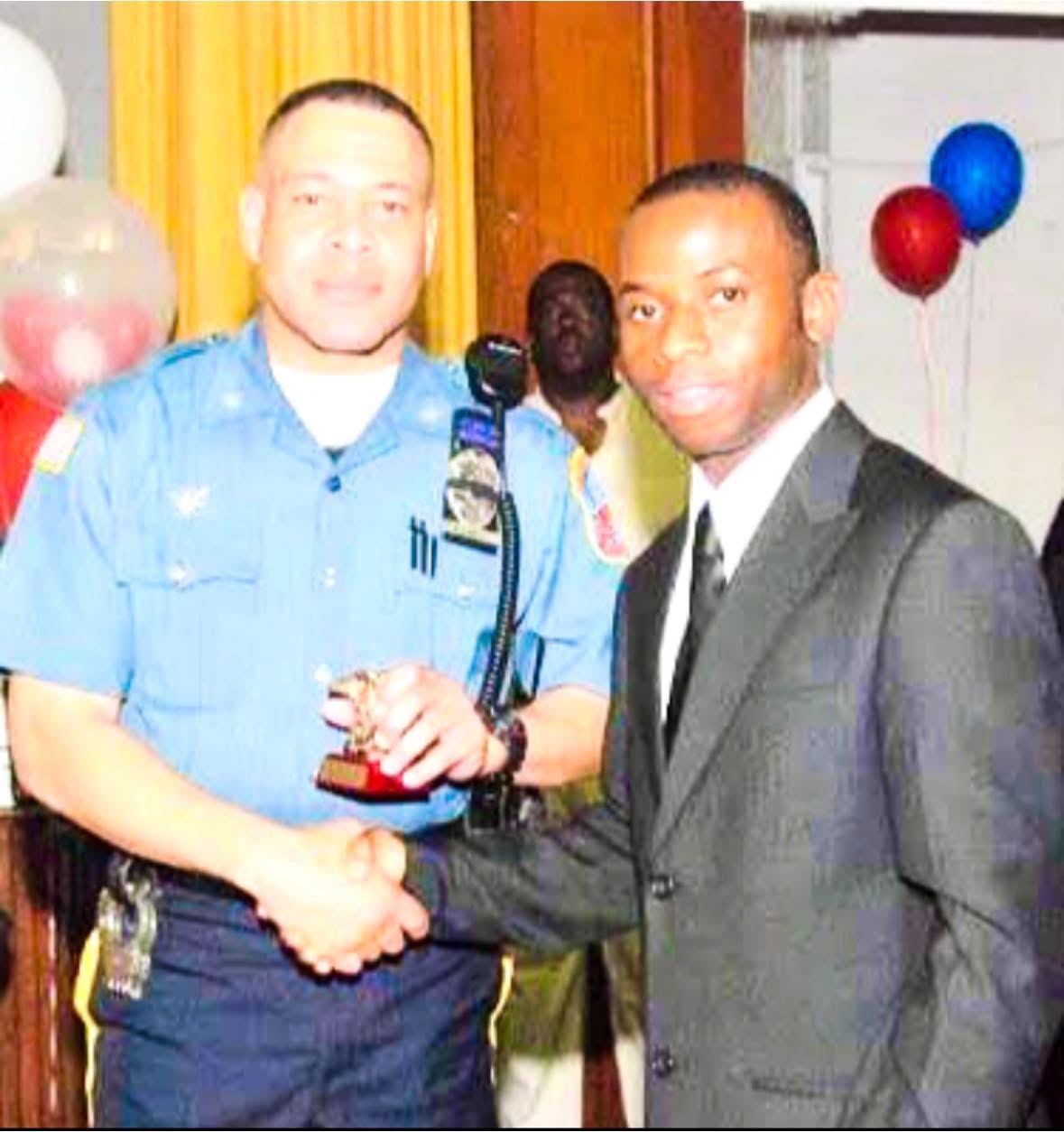 Award presentation with a law enforcement officer