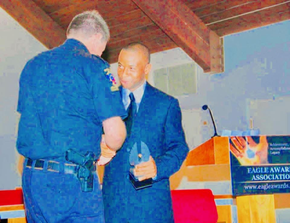 Eagle Awards Association presentation with police officer