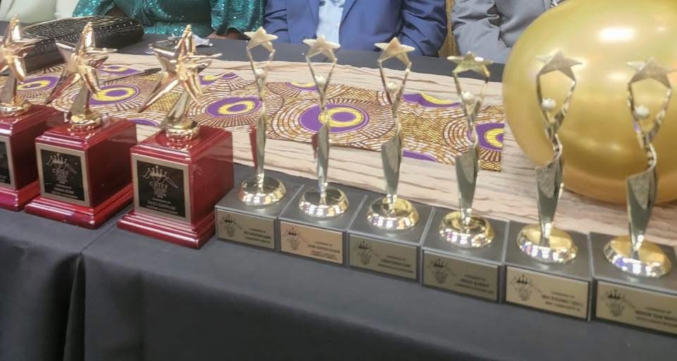 Row of 14-karat gold plated Legacy Award trophies