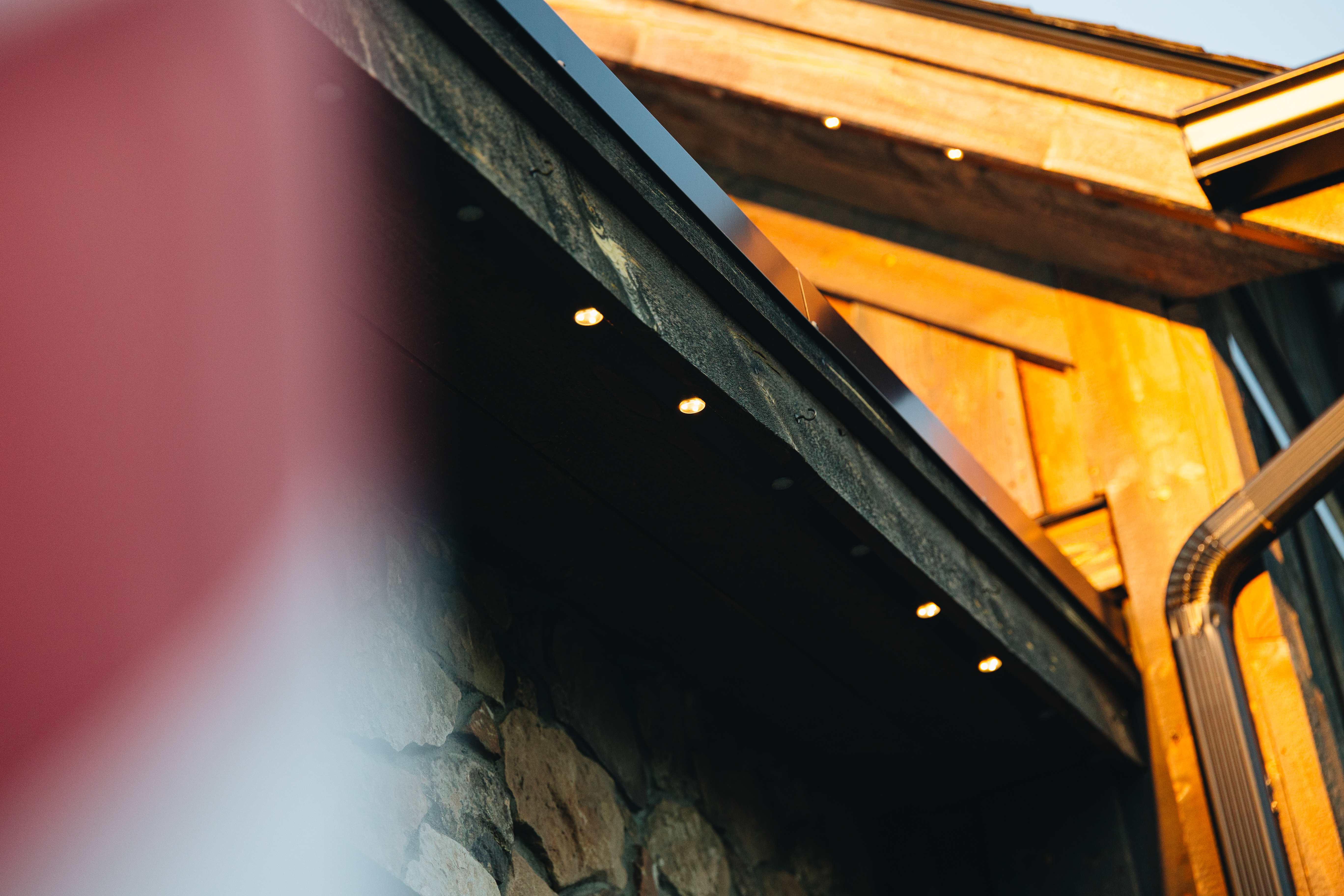 Permanent LED downlights under a timber roofline