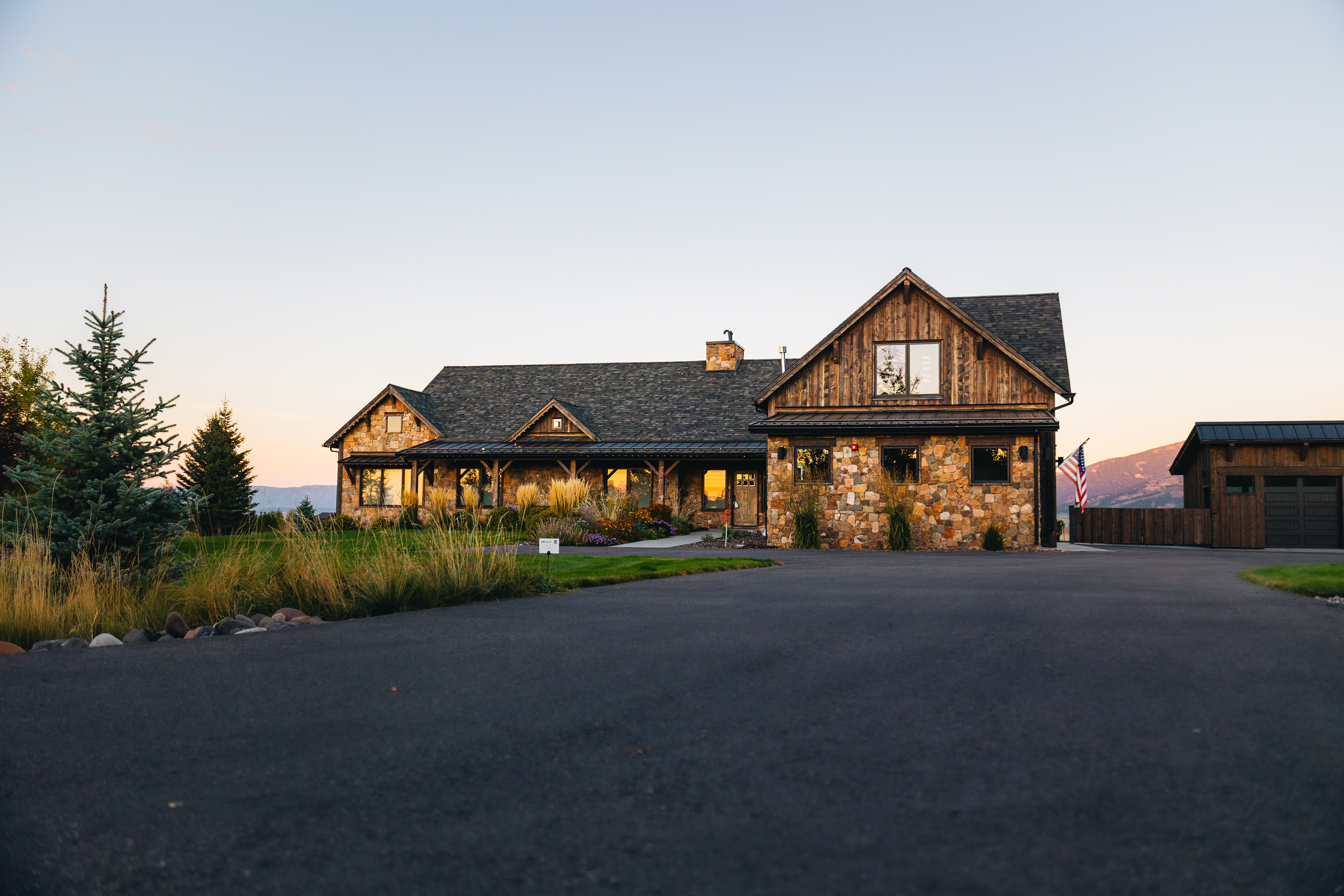 Montana home with permanent LED lighting at dusk