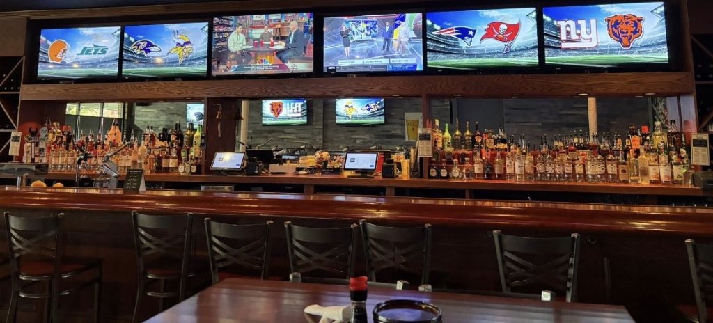 Bar interior with screens