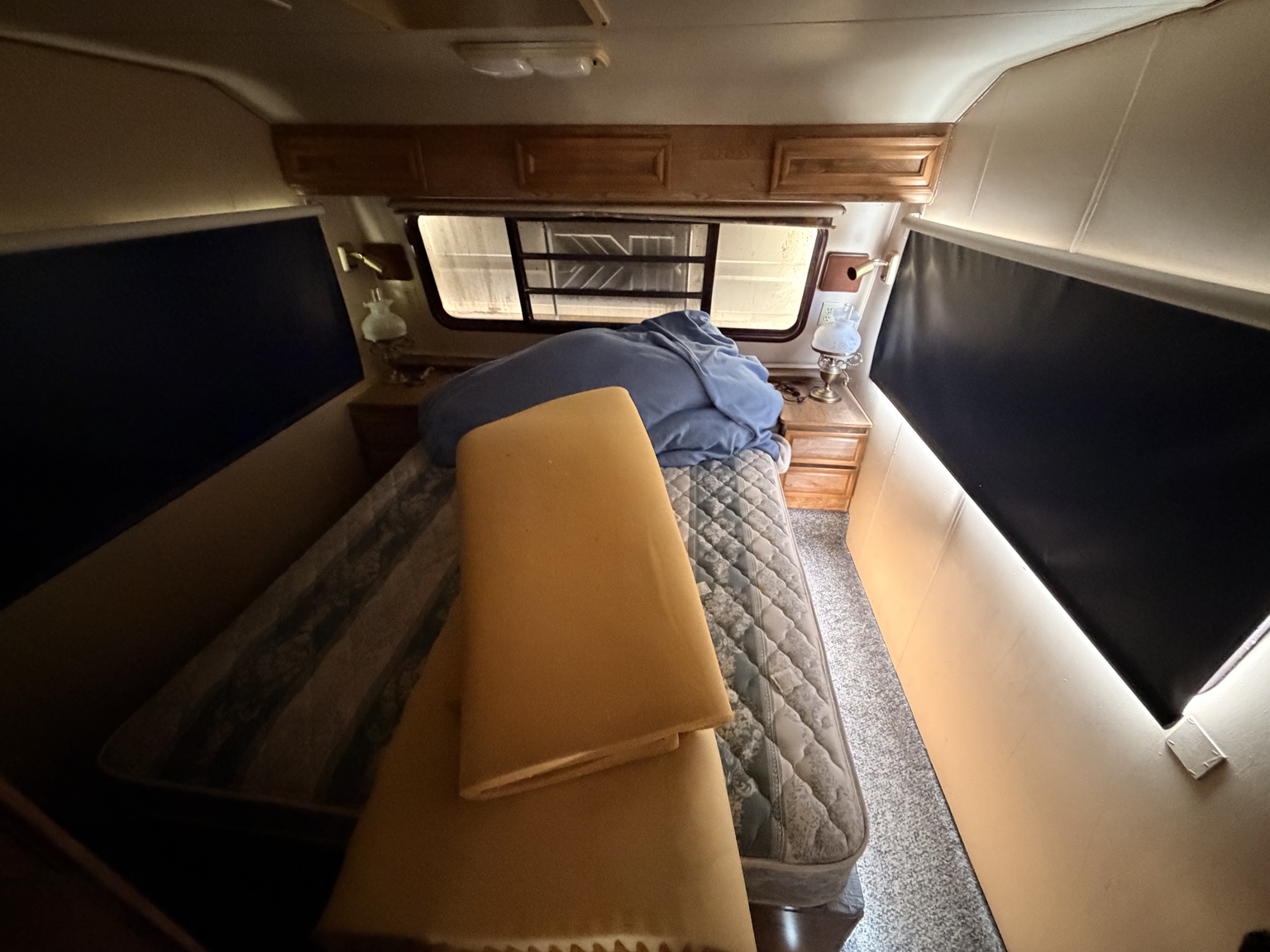 Bedroom — blackout shades & overhead storage