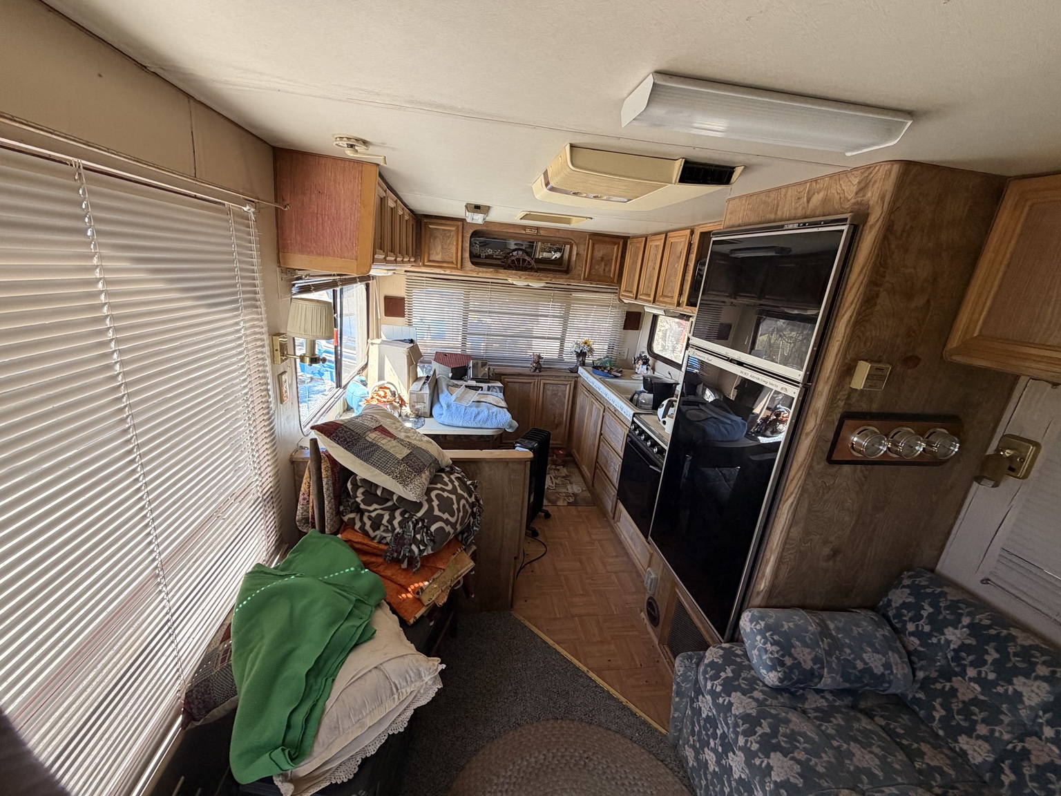 Living area — rear view through to kitchen