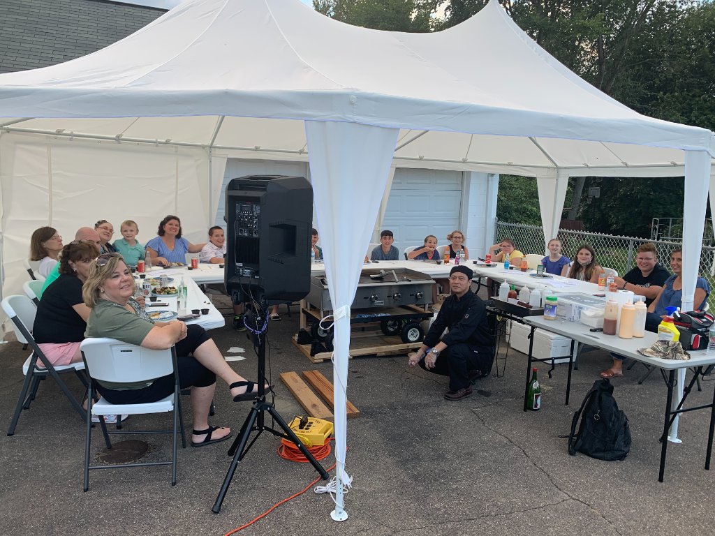 Guests watching hibachi show
