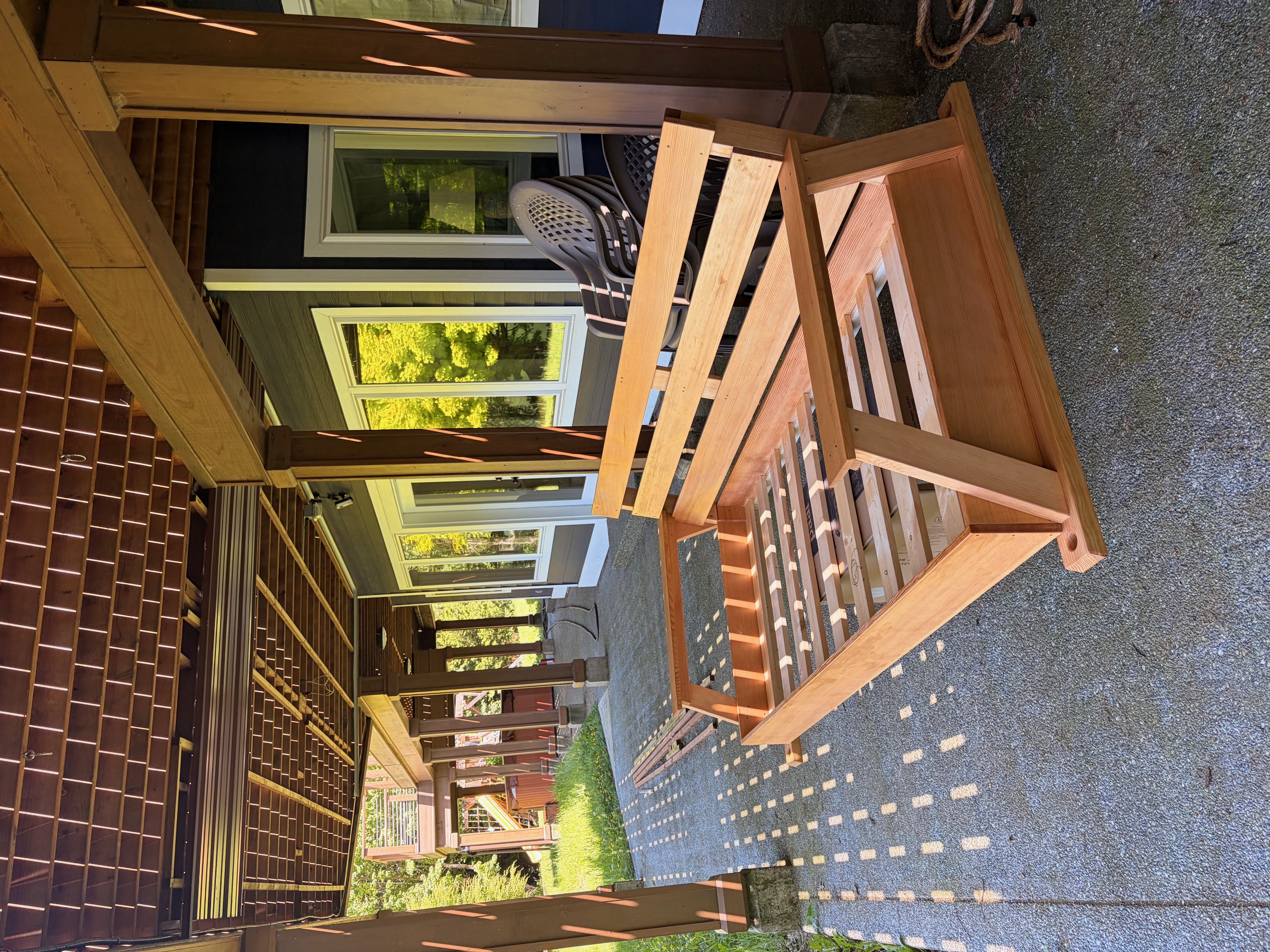 Custom-built hanging porch swing by Loft 127 Construction