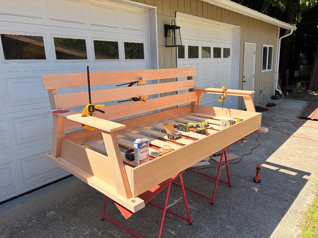 Porch swing under construction, clamped up on sawhorses