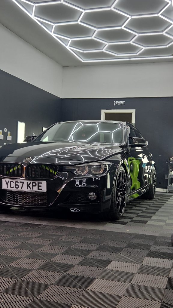 Ceramic Coating — Black BMW sedan in the detailing bay