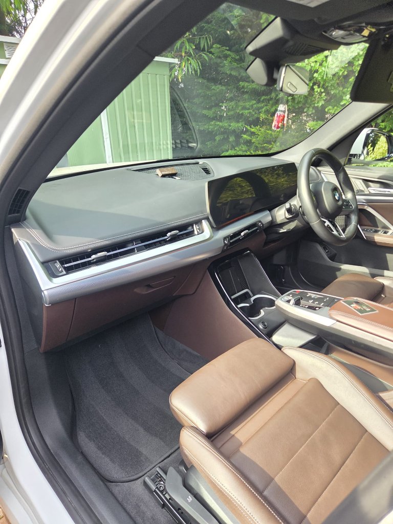 Full Valet — BMW interior with brown leather seats and console