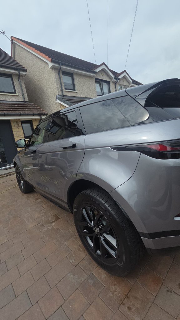 Grey Range Rover Evoque parked on driveway