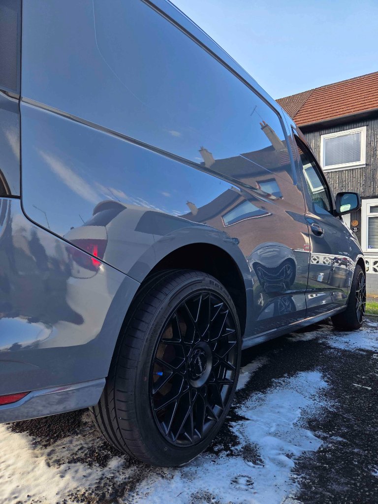 VW Caddy — gleaming side profile after wash