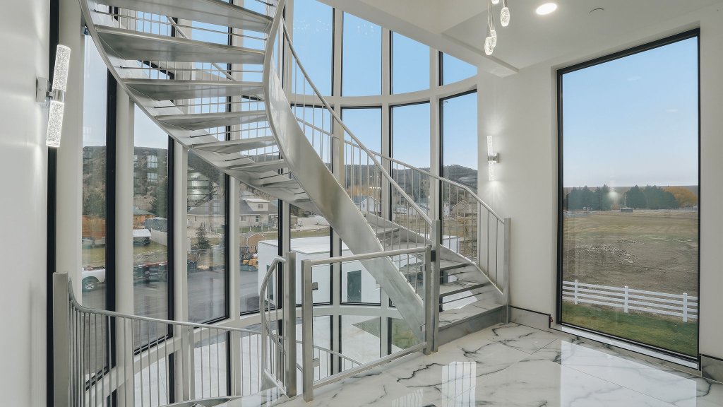 Great room — curved floor-to-ceiling glazing