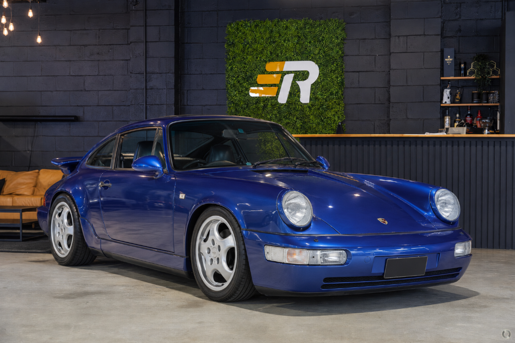 Royal blue vintage Porsche 911 staged at Rennauto