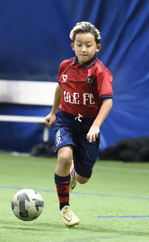 Ole FC player dribbling