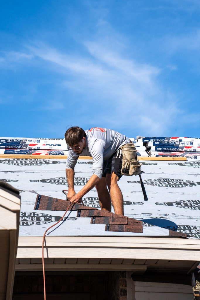 Ridge Roofing crew installing shingles