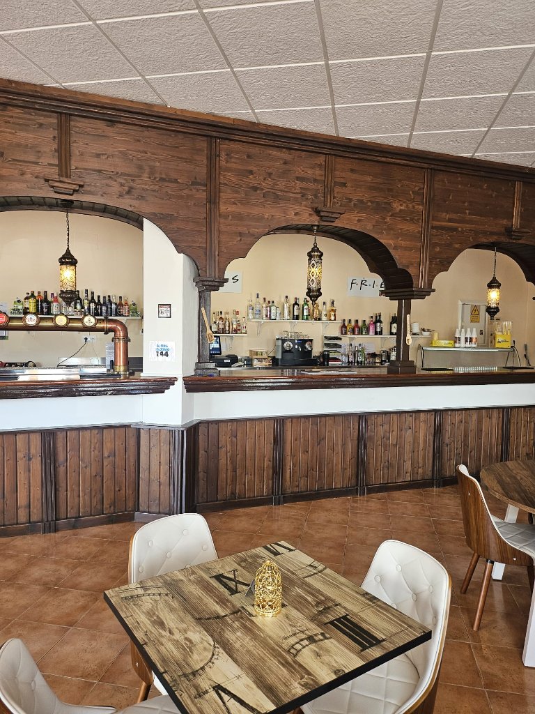 The bar area with arches and spirits