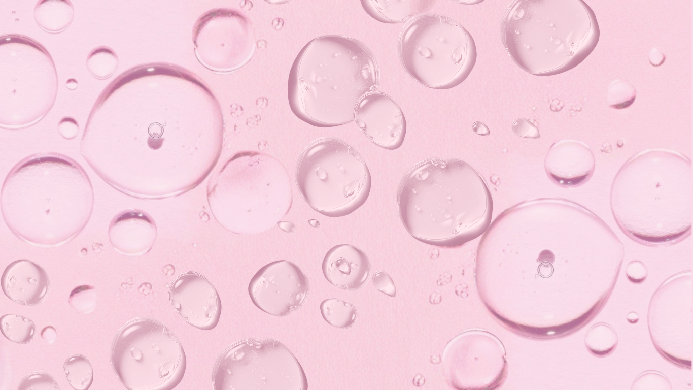 Transparent serum droplets resting on a soft pink surface