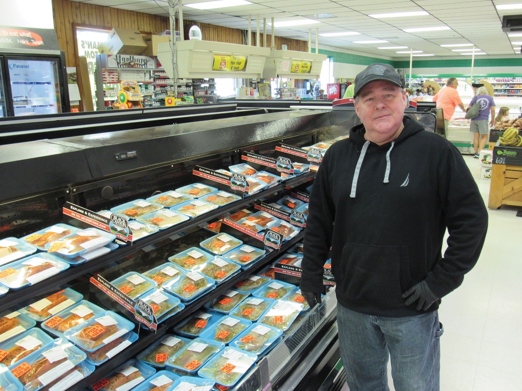 Owner at the meat case
