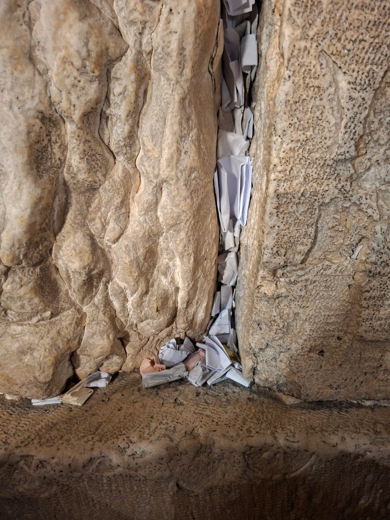 Thousands of prayers, folded and placed — each one carrying someone's deepest hope.