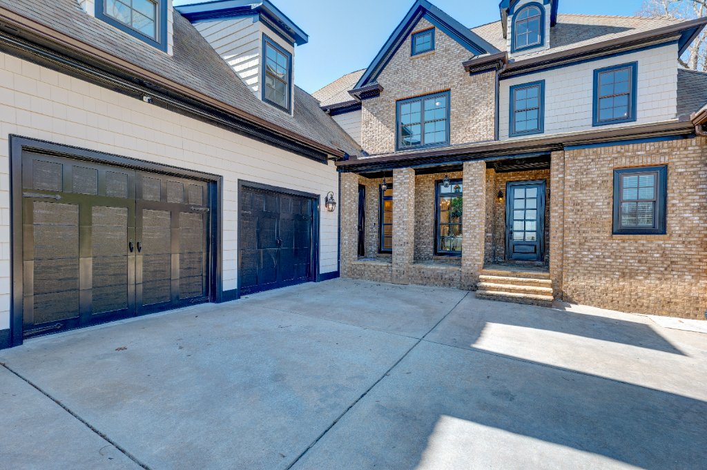 Front Entry & 3-Car Garage - 1049 Highland Village Trail