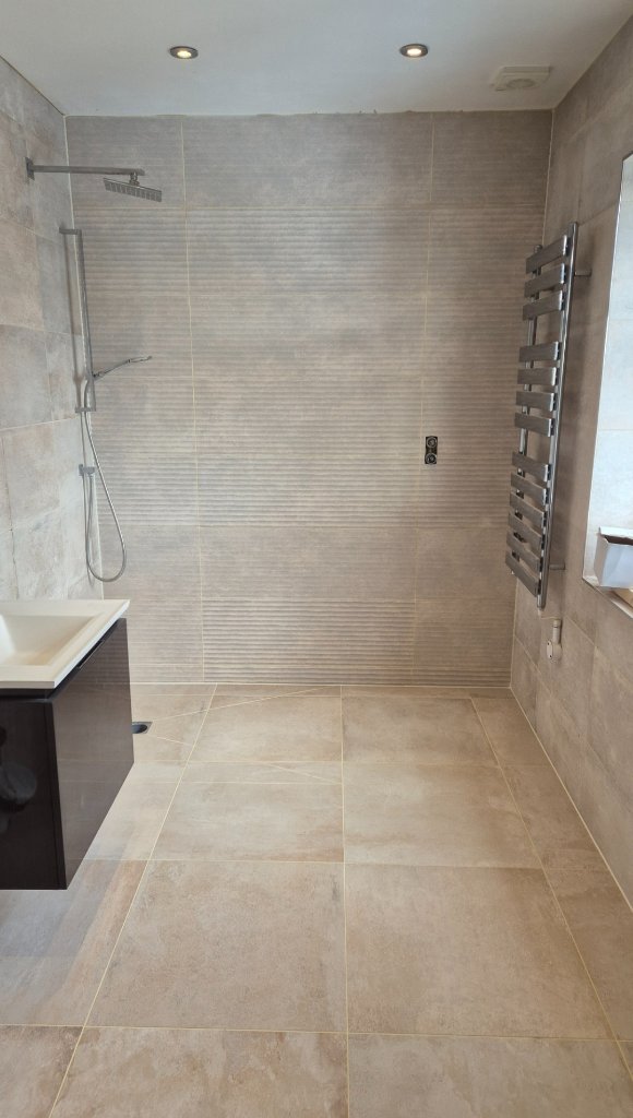 Completed wet room with large-format porcelain floor and wall tiles in Warrington