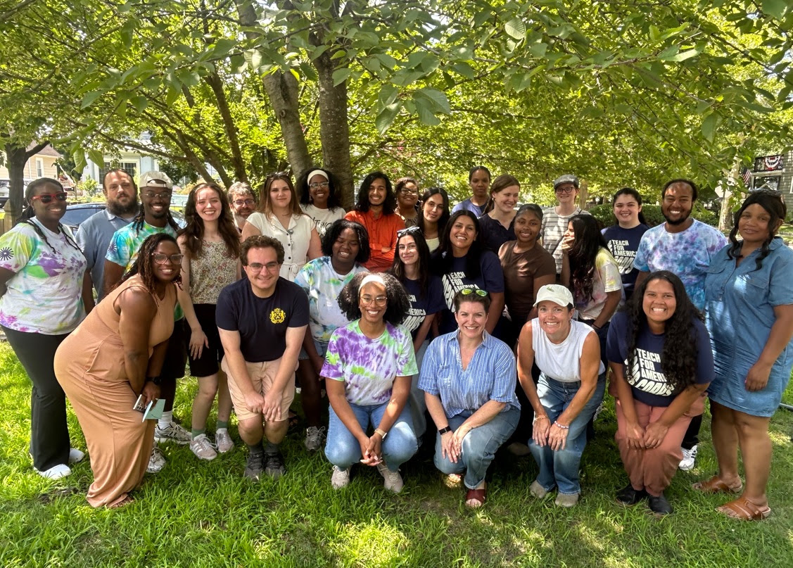 A community gathering under the shade of a tree