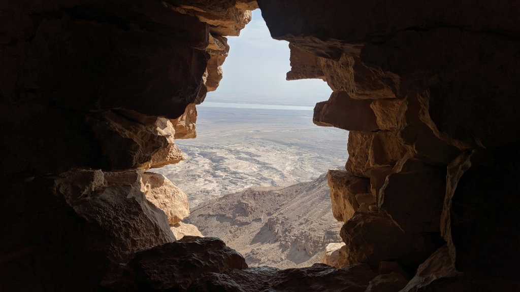 View through a cave opening over the Judean Desert