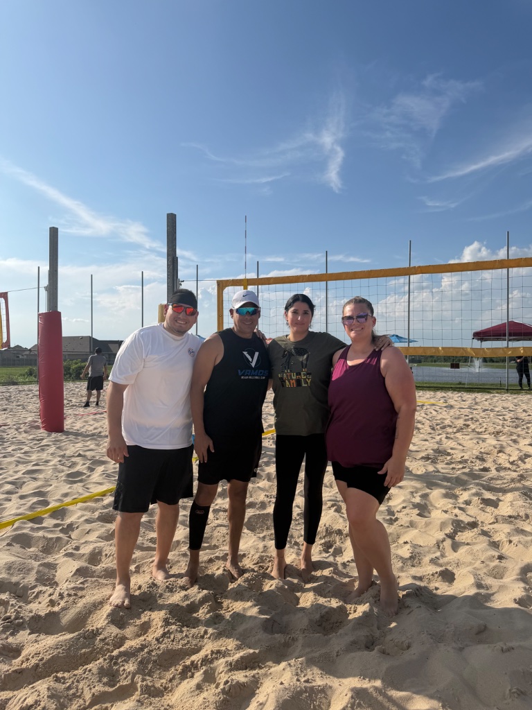 Team photo on sand court at The Bing