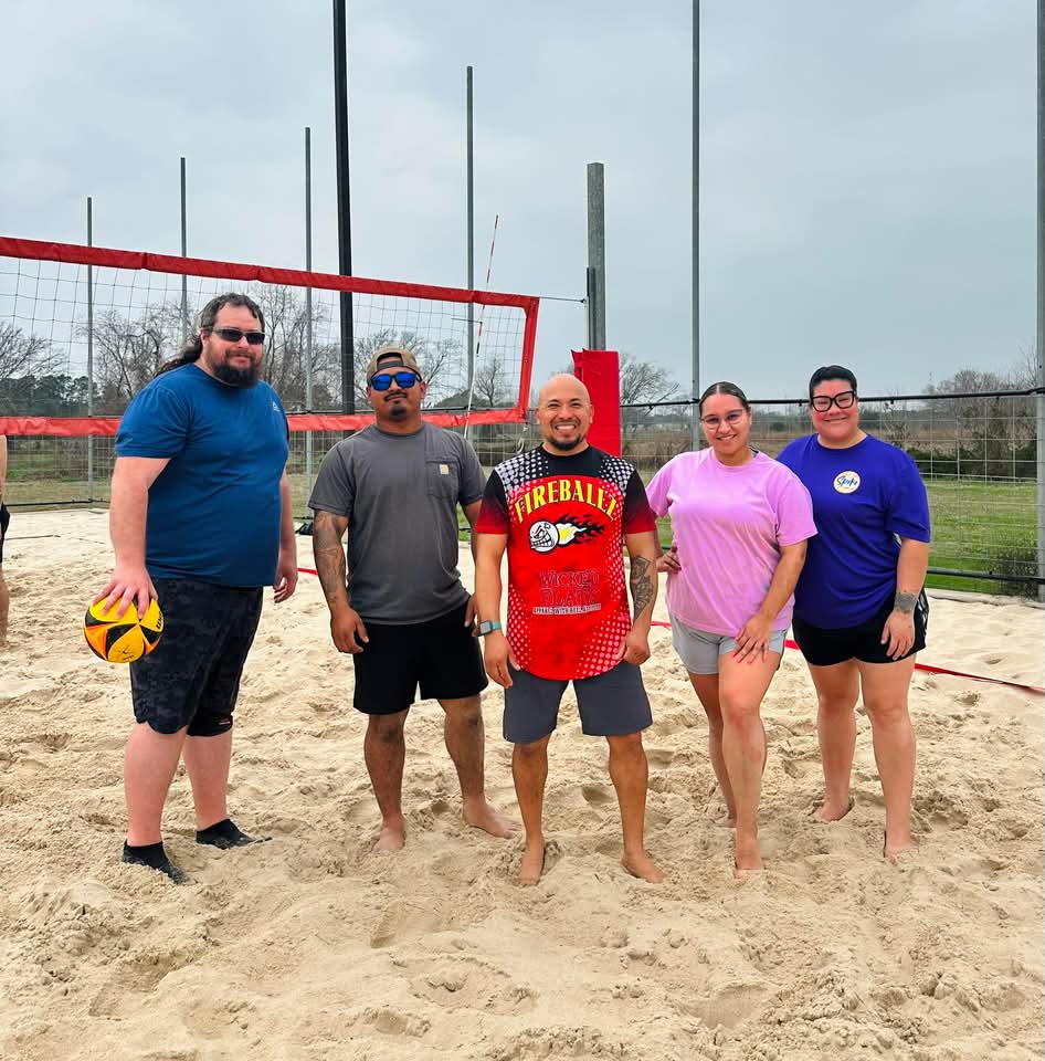 Team photo at the net