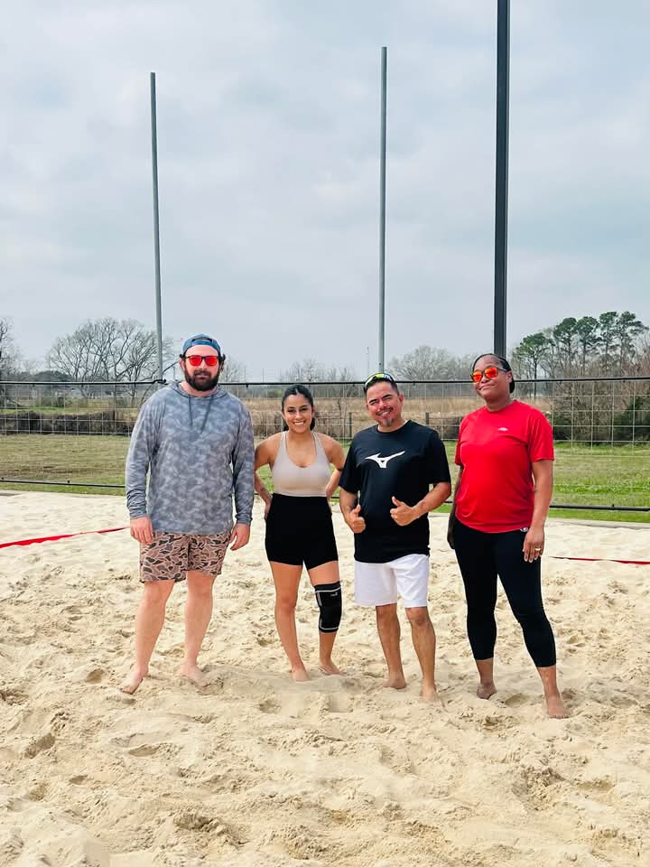 Team photo on sand court