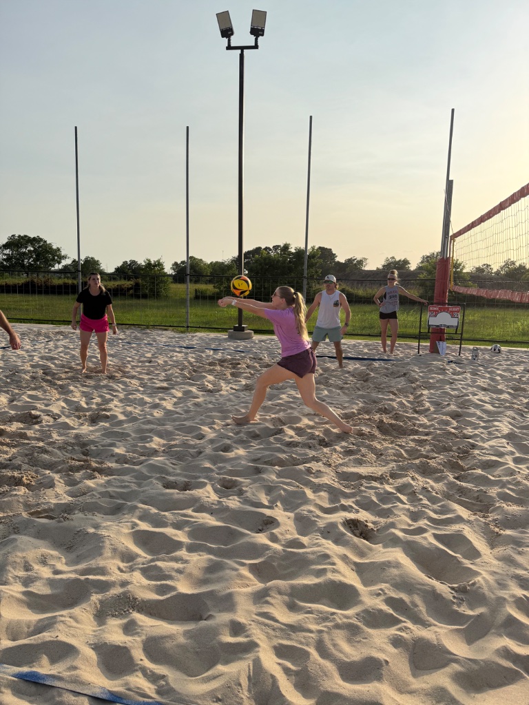Houston Spike Series Wednesday League player passing the volleyball during sunset league play.