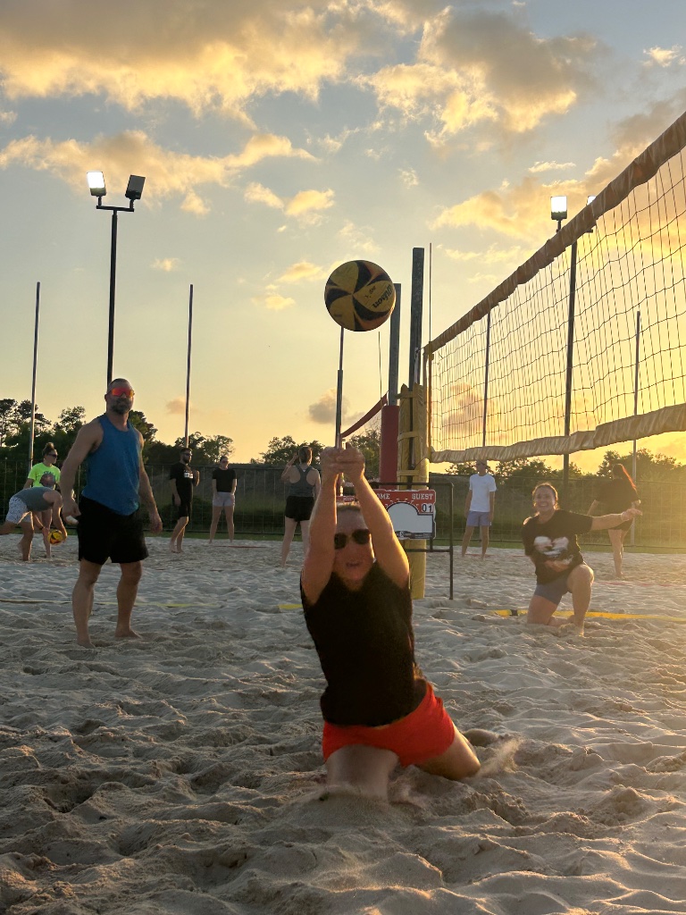 Player setting ball on knees at golden hour