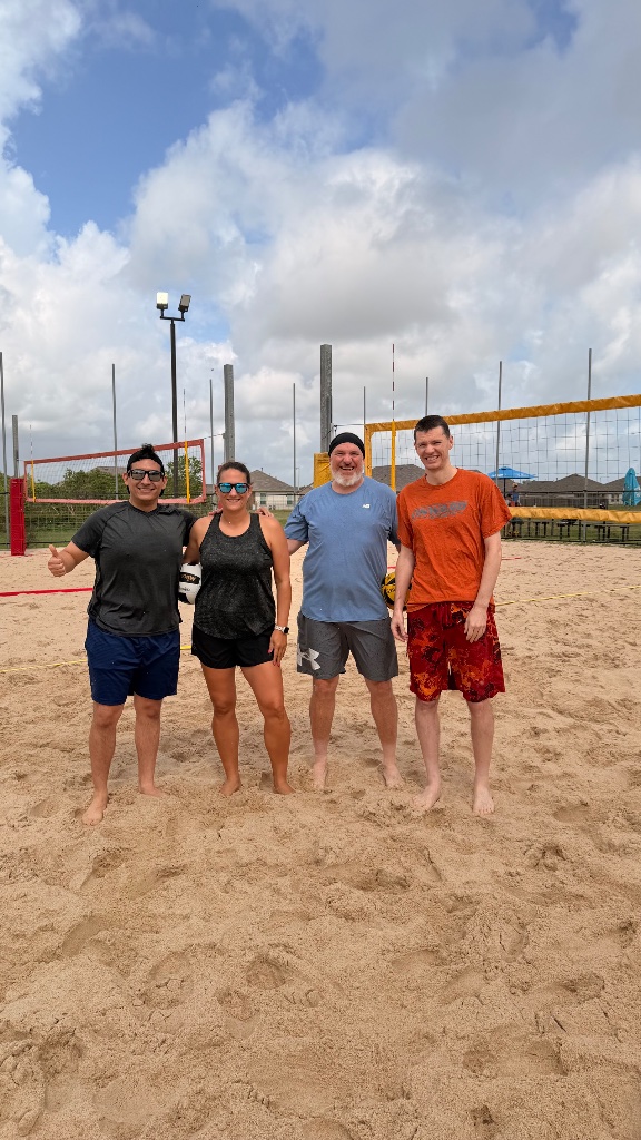 Team photo on sand court