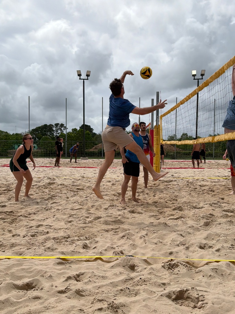 Team photo on sand court