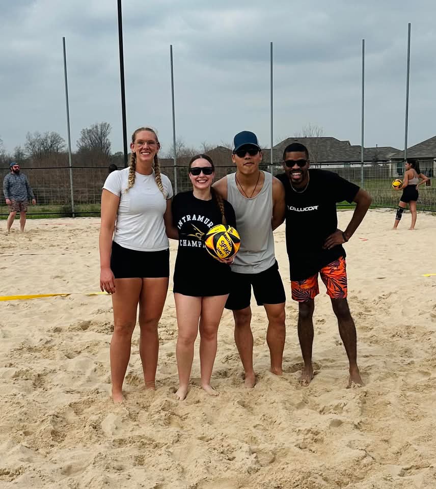Team photo on sand court