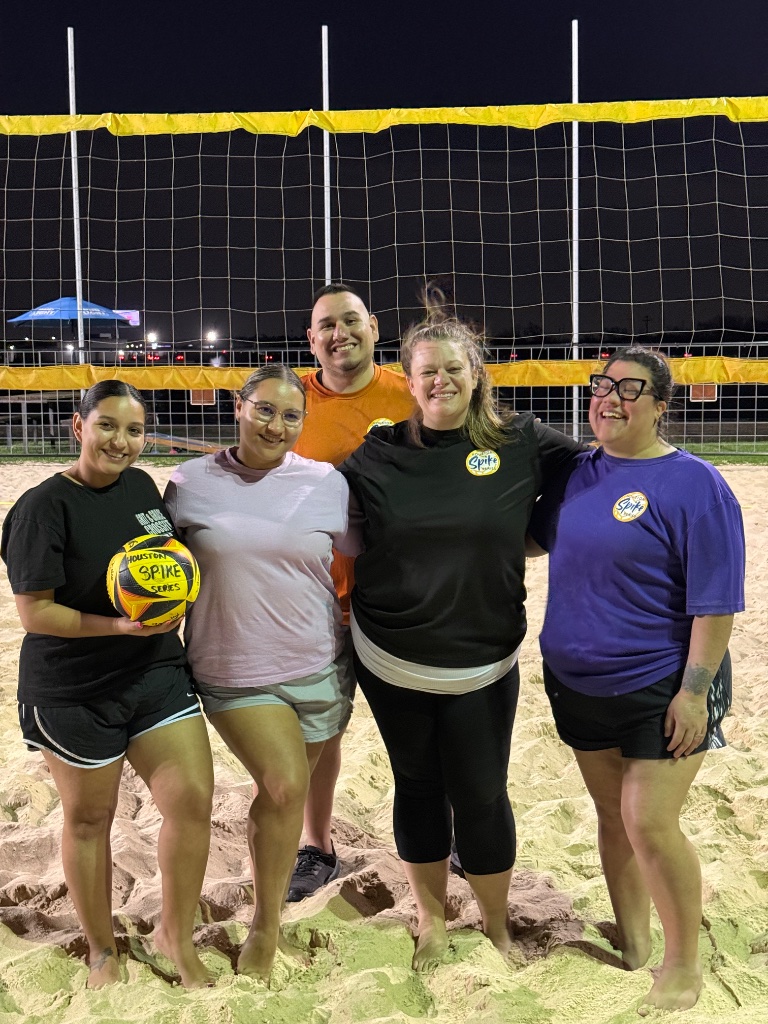 Team photo at night with Houston Spike Series ball