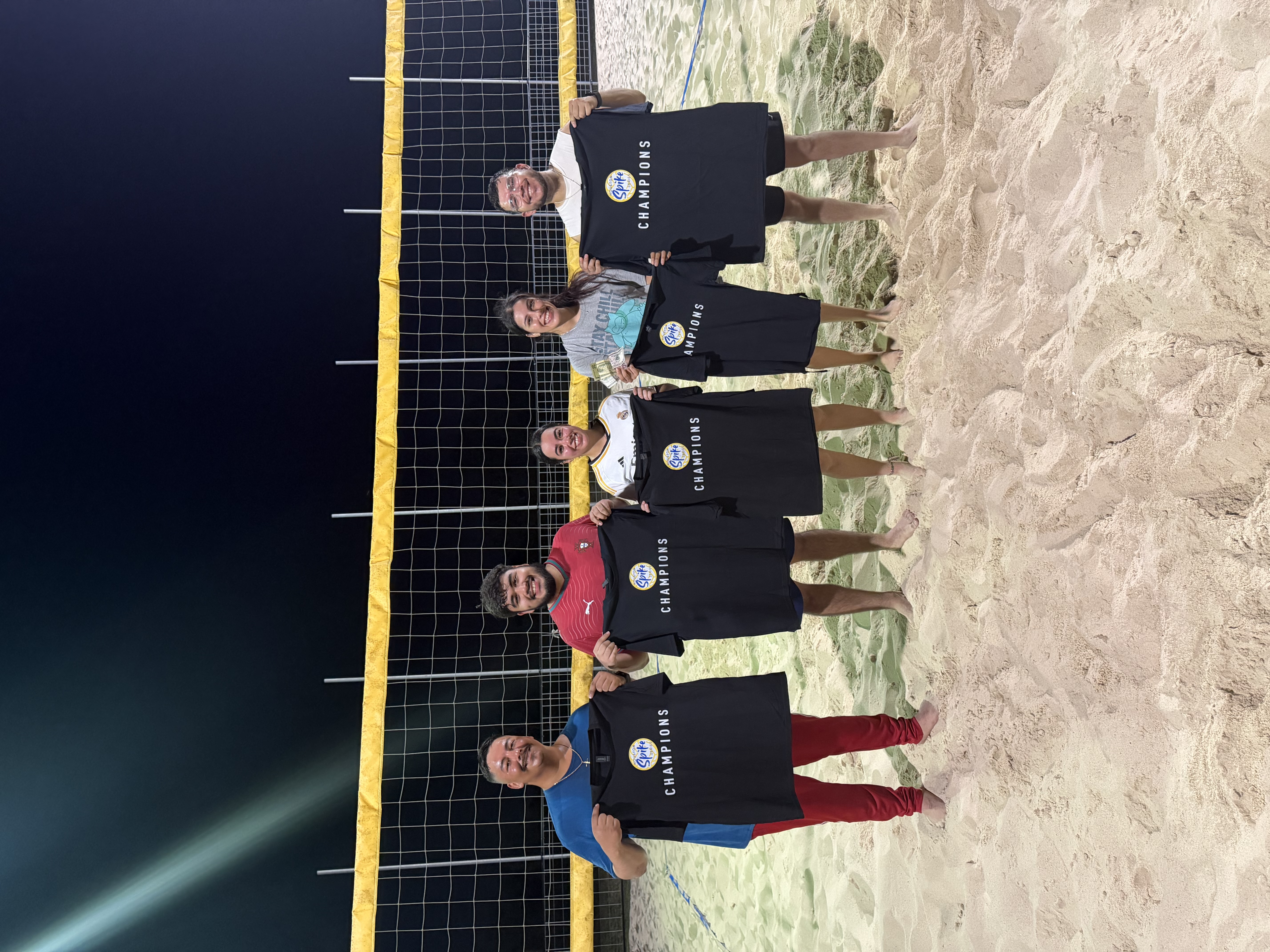 Unprotected Sets — Thursday Night Season 2 Champions celebrating with championship t-shirts on the court.