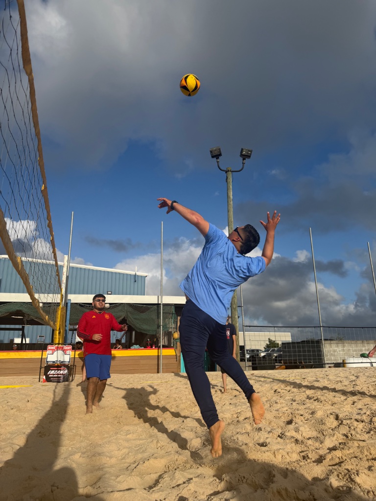 Team photo on sand court