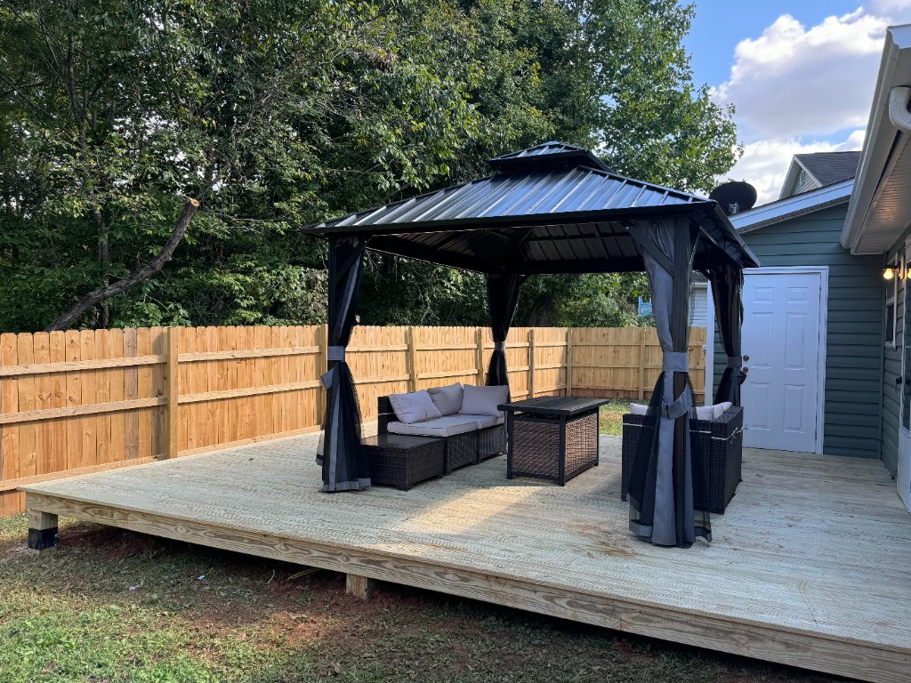 Hardtop gazebo on wood deck