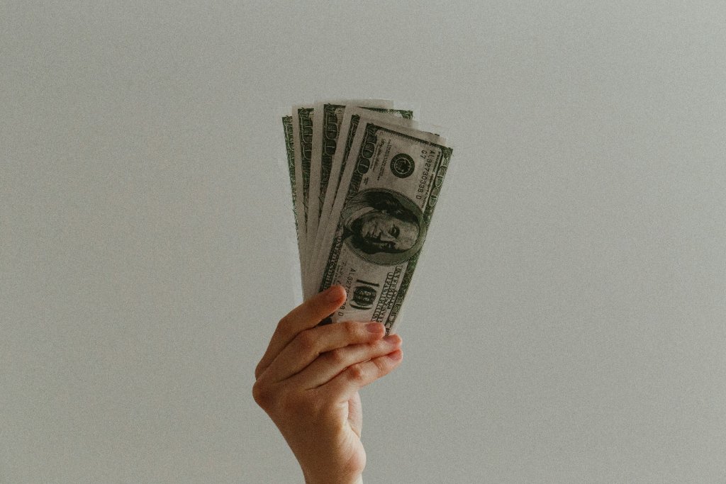 Hand holding cash