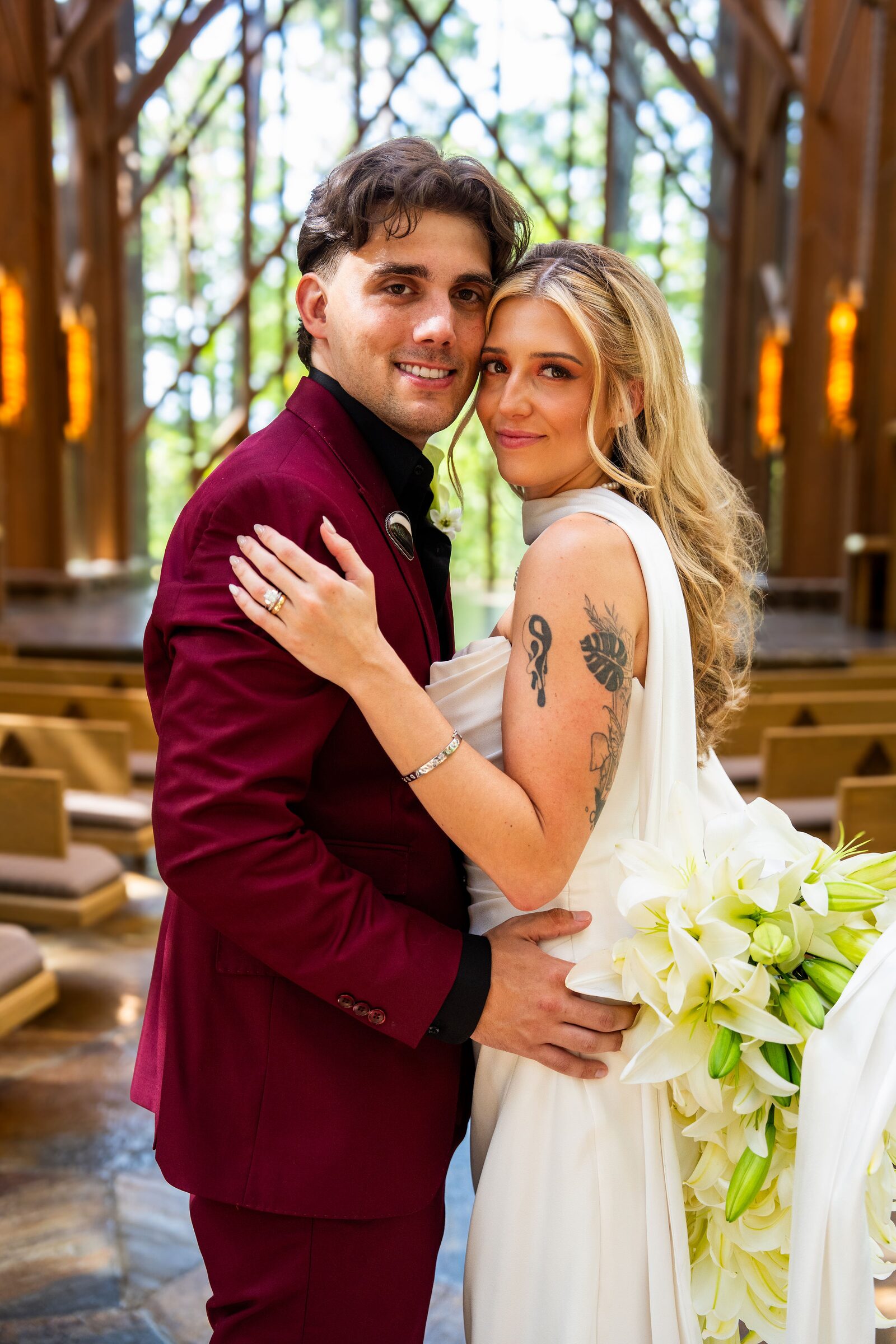 Bride and groom embracing in a close portrait inside the chapel