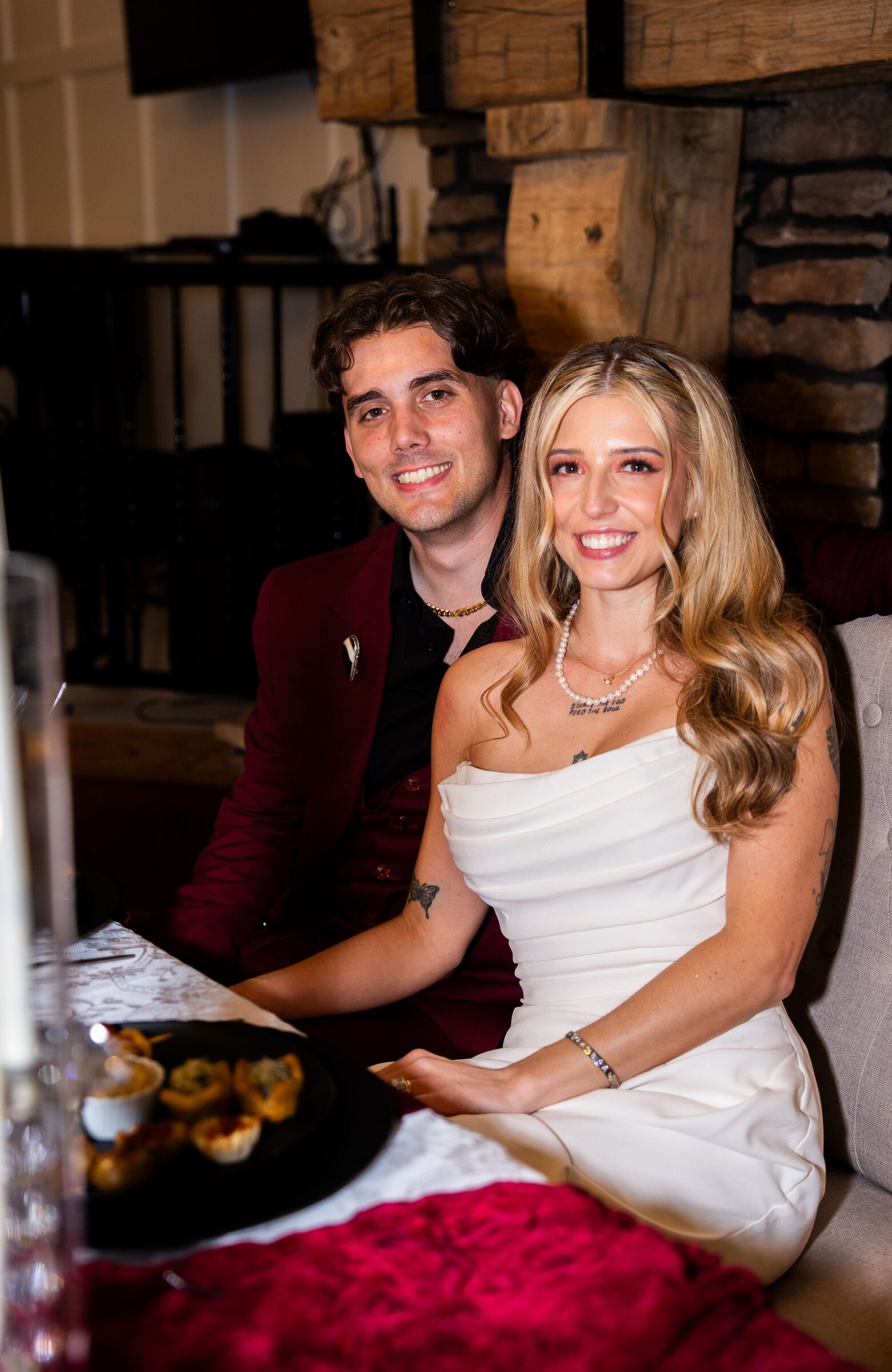 Bride and groom seated together at their reception at Garvan Woodland Gardens, Hot Springs, Arkansas