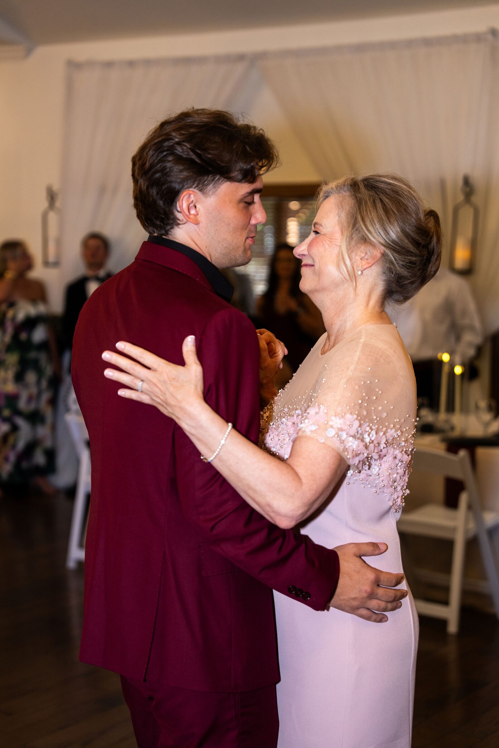 Groom dancing with his mother at the reception at Garvan Woodland Gardens, Hot Springs, Arkansas